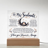 A square acrylic LED light sign with romantic text for a soulmate, featuring a bird and crescent moon illustration, displayed on a wooden base against a white background.