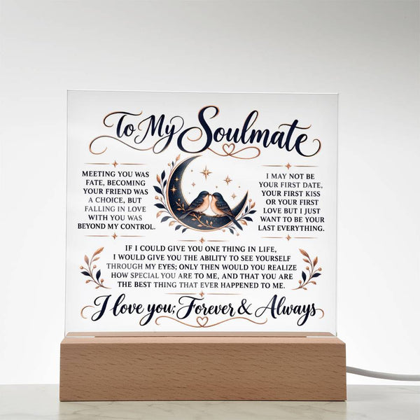 A square acrylic LED light sign with romantic text for a soulmate, featuring a bird and crescent moon illustration, displayed on a wooden base against a white background.