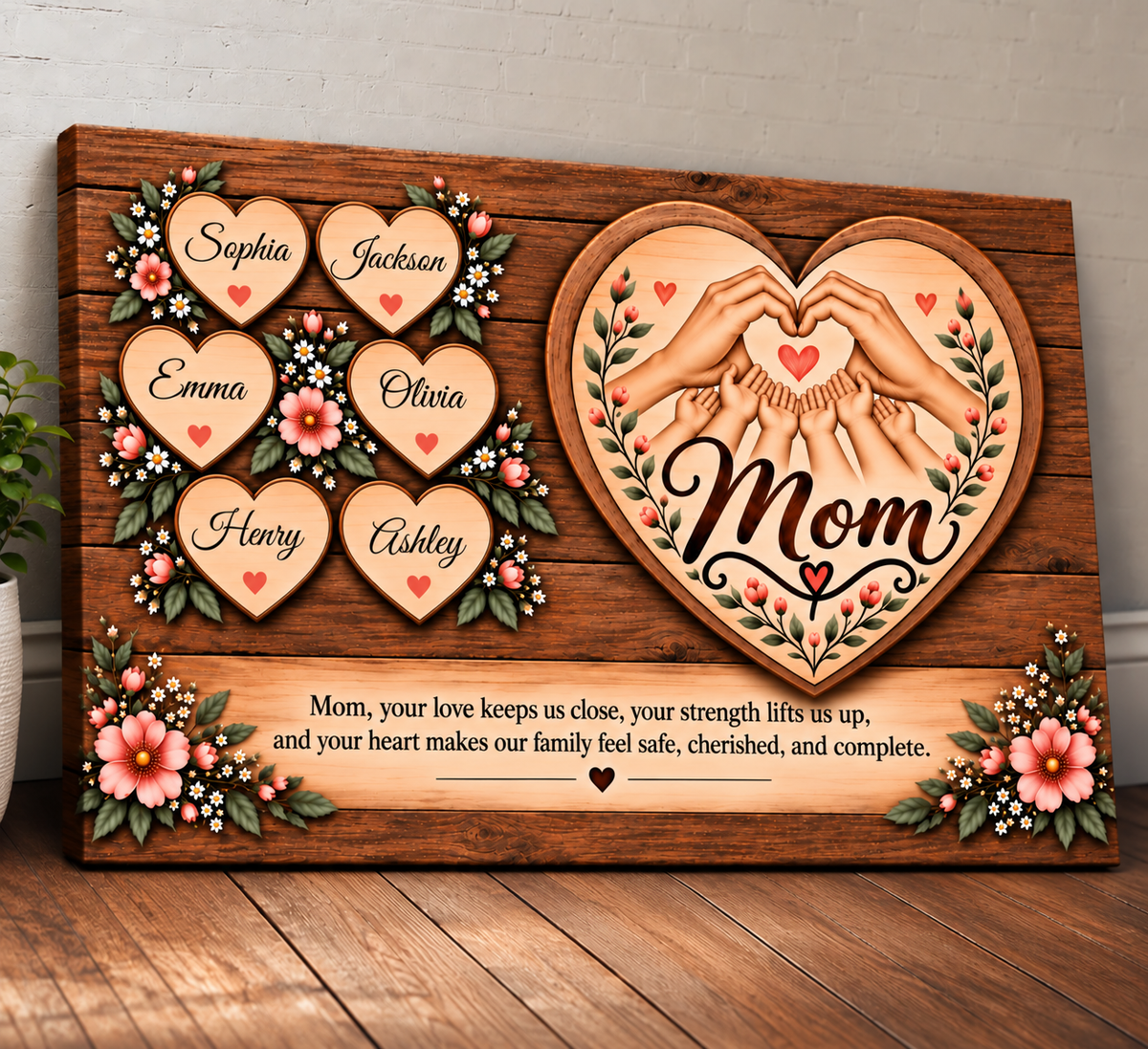 Personalized wooden plaque for Mom featuring carved heart-shaped name panels, floral accents, two hands forming a heart, and a sentimental message, displayed on a wooden floor against a light wall.